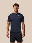 Male model wearing midnight navy Apex Training T-Shirt with crew neck raglan sleeves and Castore branding on the chest