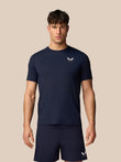 Male model wearing navy Apex Training T-Shirt with crew neck and white Castore logo on the chest, regular fit and short sleeves.