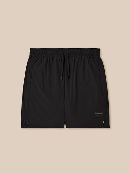 Black shorts on a beige background