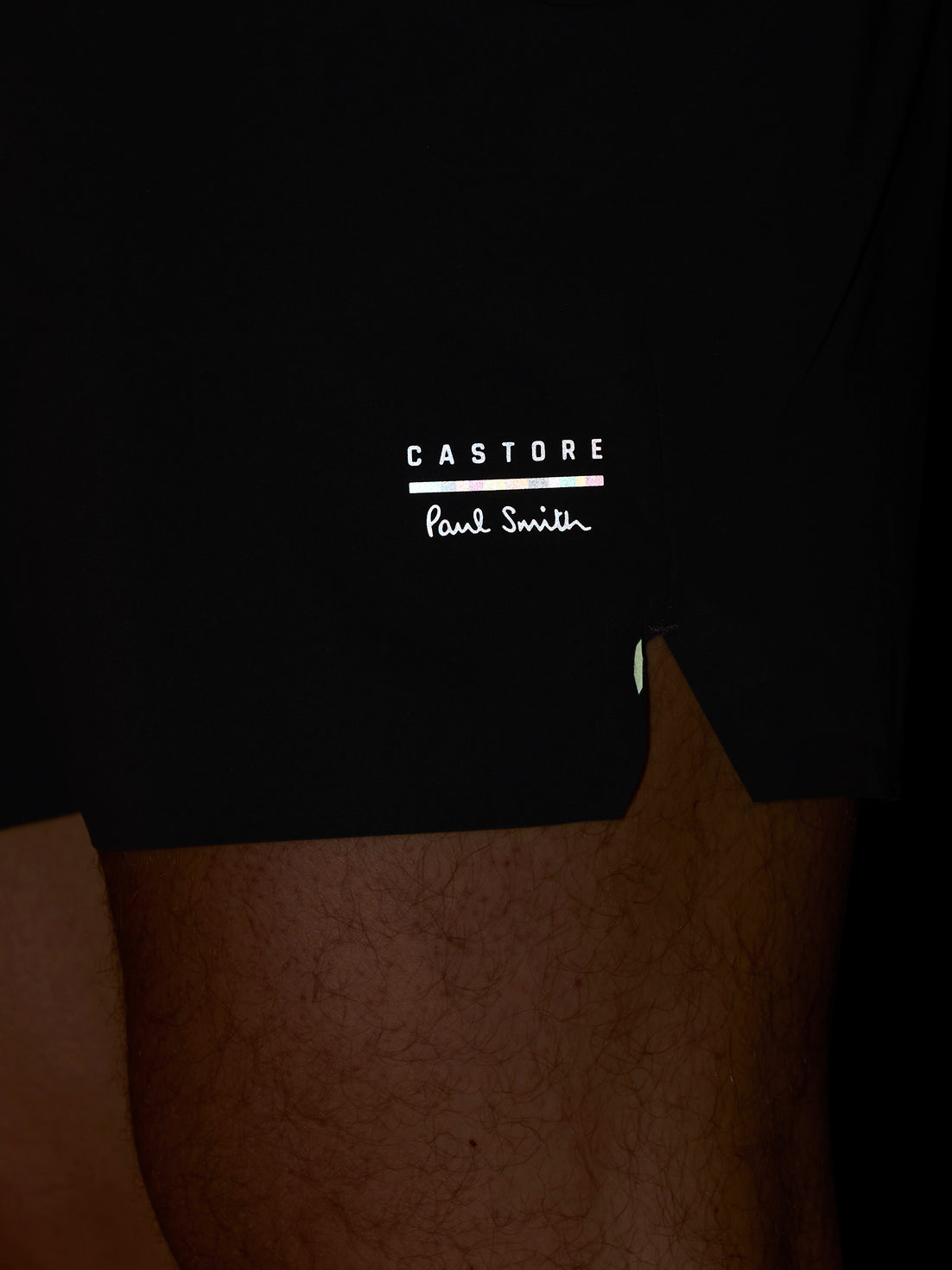 Black shorts with 'Castore' and 'Paul Smith' logos on a person wearing it.