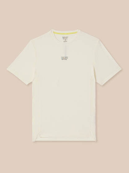White t-shirt with text on a beige background