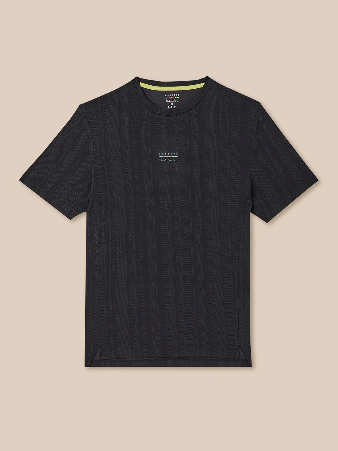 Black t-shirt with a small white logo on a beige background