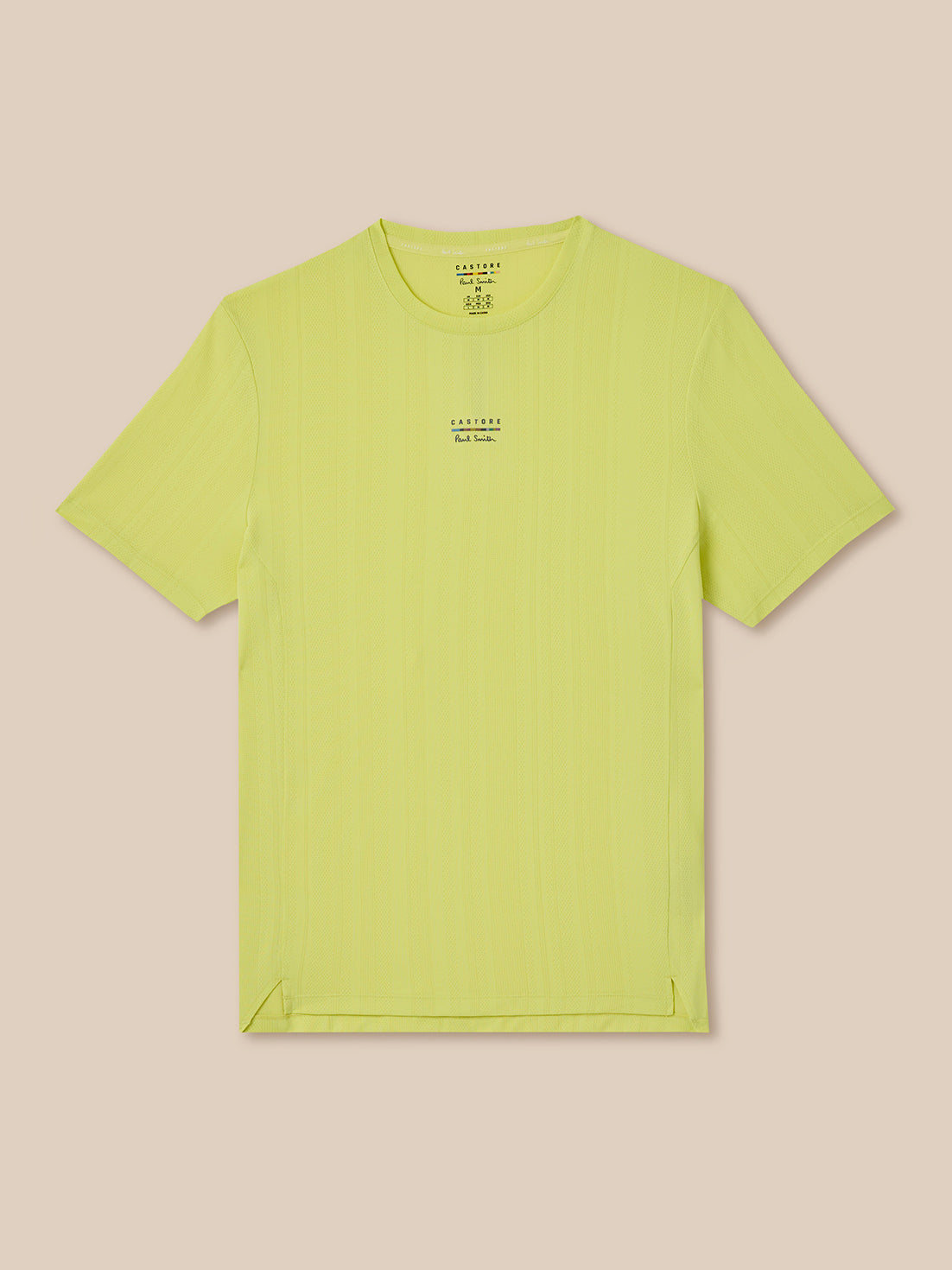 Light green t-shirt with a small logo on a beige background