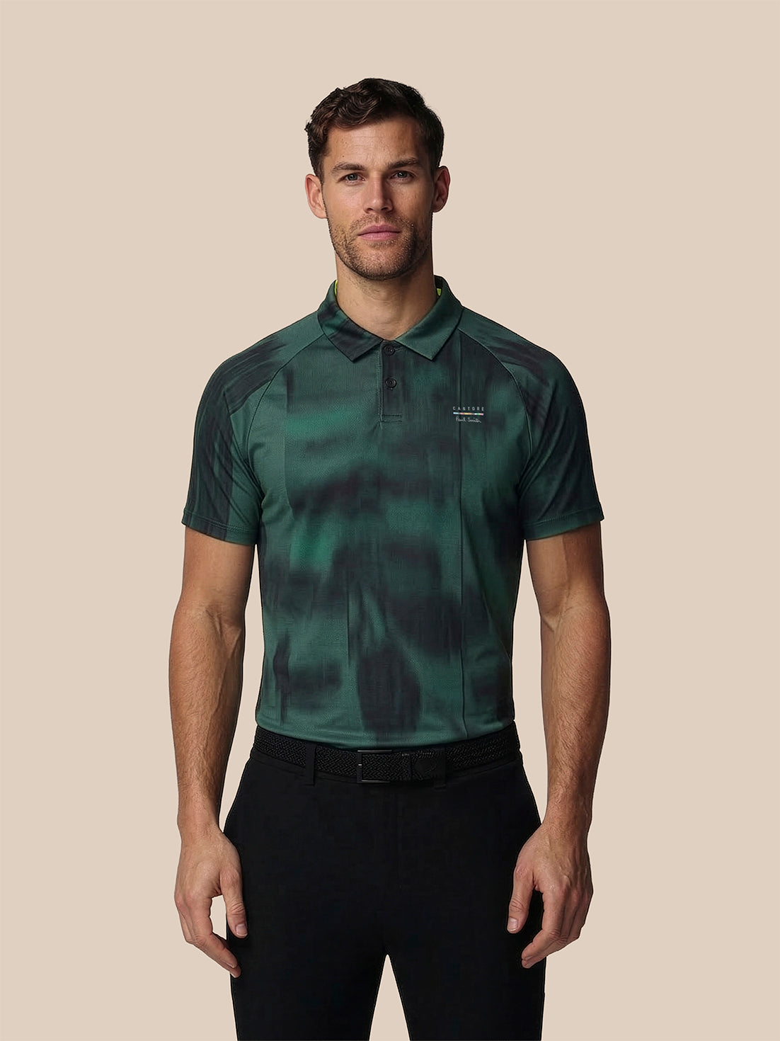 Man wearing a green camouflage polo shirt on a beige background
