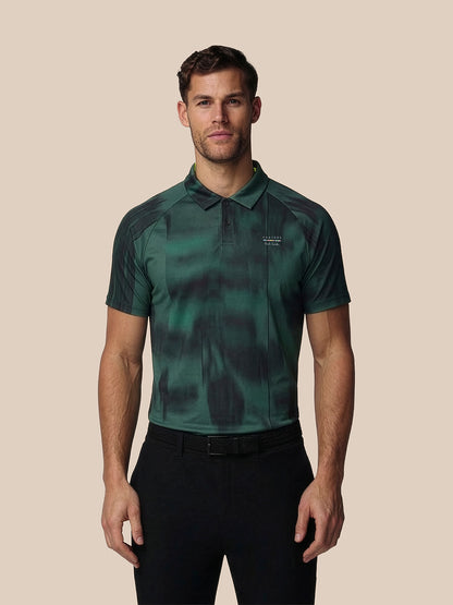 Man wearing a green camouflage polo shirt on a beige background
