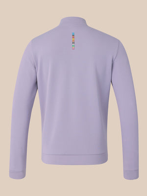 A light purple long-sleeve quarter-zip sweatshirt shown from the back, featuring a small colorful vertical logo on the upper back, set against a solid beige background.