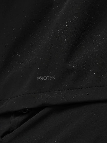Close-up of black fabric with 'PROTEK' branding.