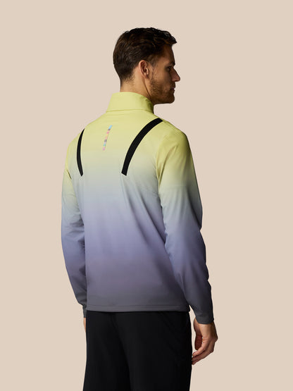 Man wearing a gradient jacket with a beige background