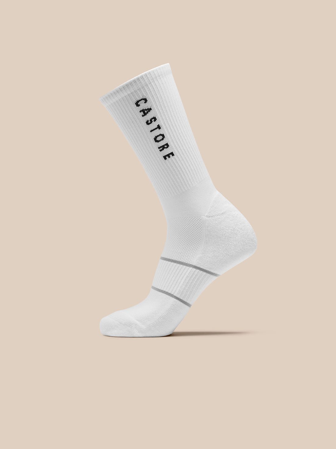 White Castore core crew sock with ribbed cuff and two gray stripes near the ankle