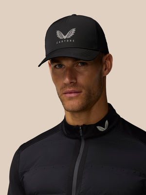 Model wearing black Castore Active Cap with halo eyelets and front logo