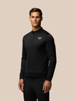 Male golfer wearing black Golf Club Classic 1/4 Zip Top with stand collar and chest branding.