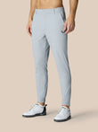 Front view of mid grey Golf Pinnacle Trousers with belt loops zip fly side pockets and a logo on the right thigh.