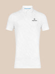 Front view of a white Majesticks polo with golf ball texture and a left chest logo