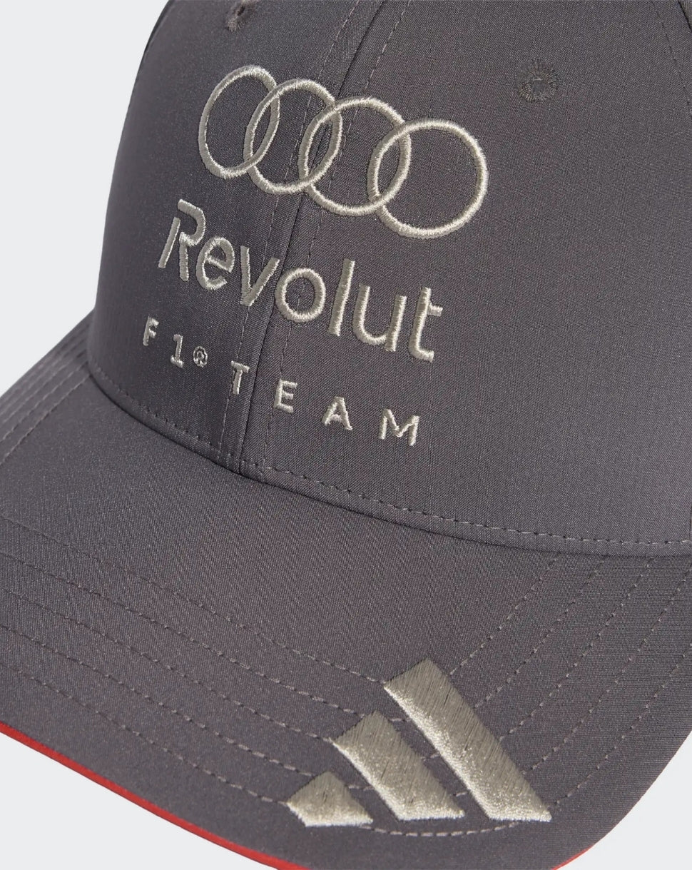 Close up of front grey cap showing Revolut F1 Team embroidery, Audi rings, and silver triangle accents at the brim.