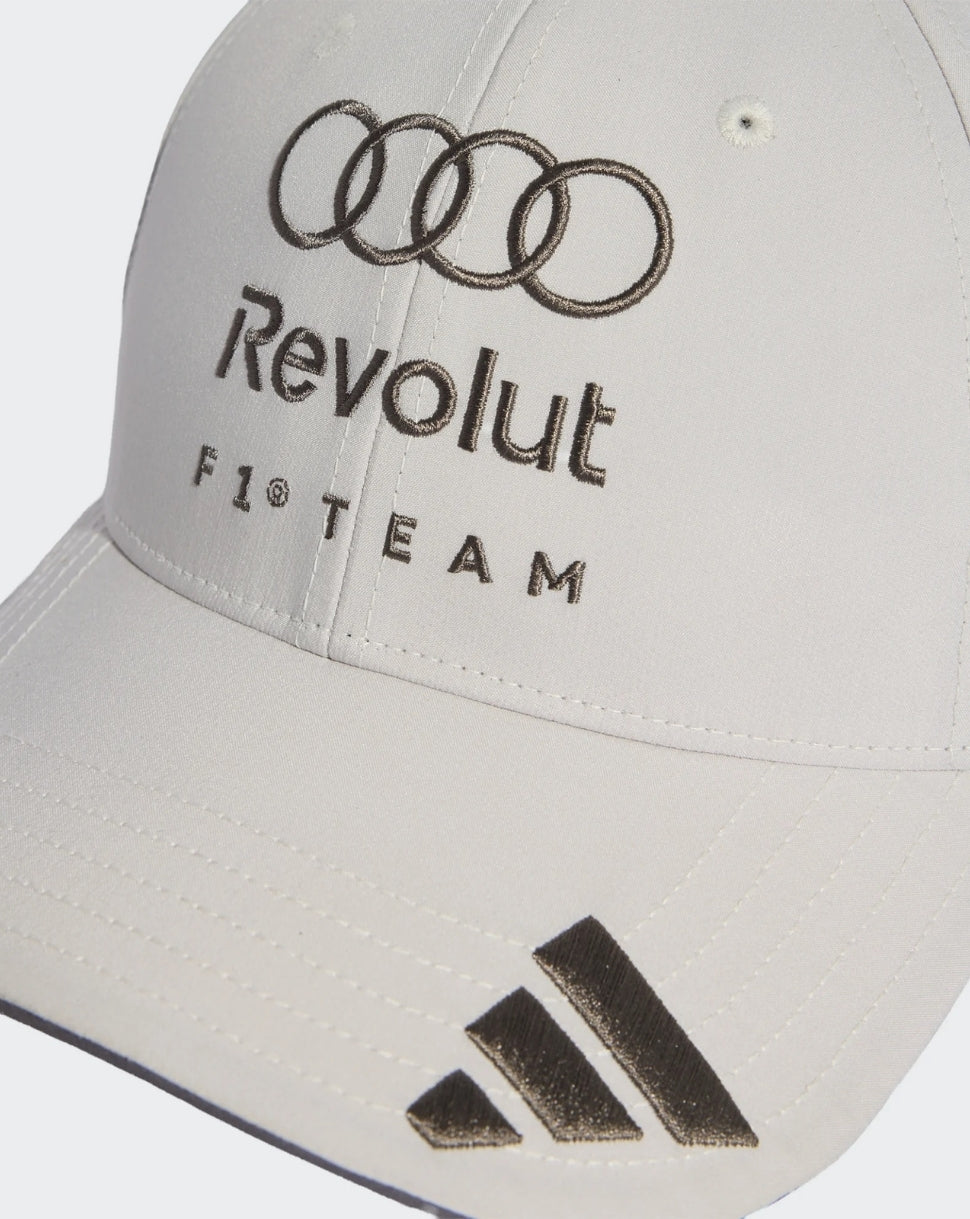 Close up of front of white Audi Team cap with Revolut F1 Team embroidery and Adidas stripes on brim