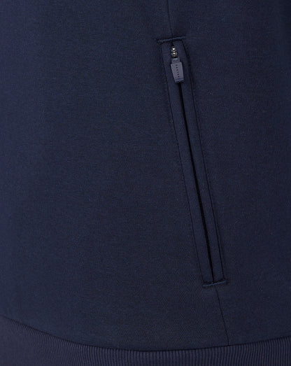 Navy blue fabric with a zipper detail on a dark background
