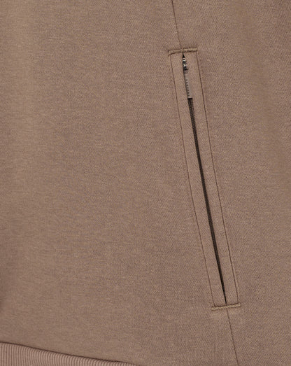 Close-up of a brown fabric with a zipper pocket