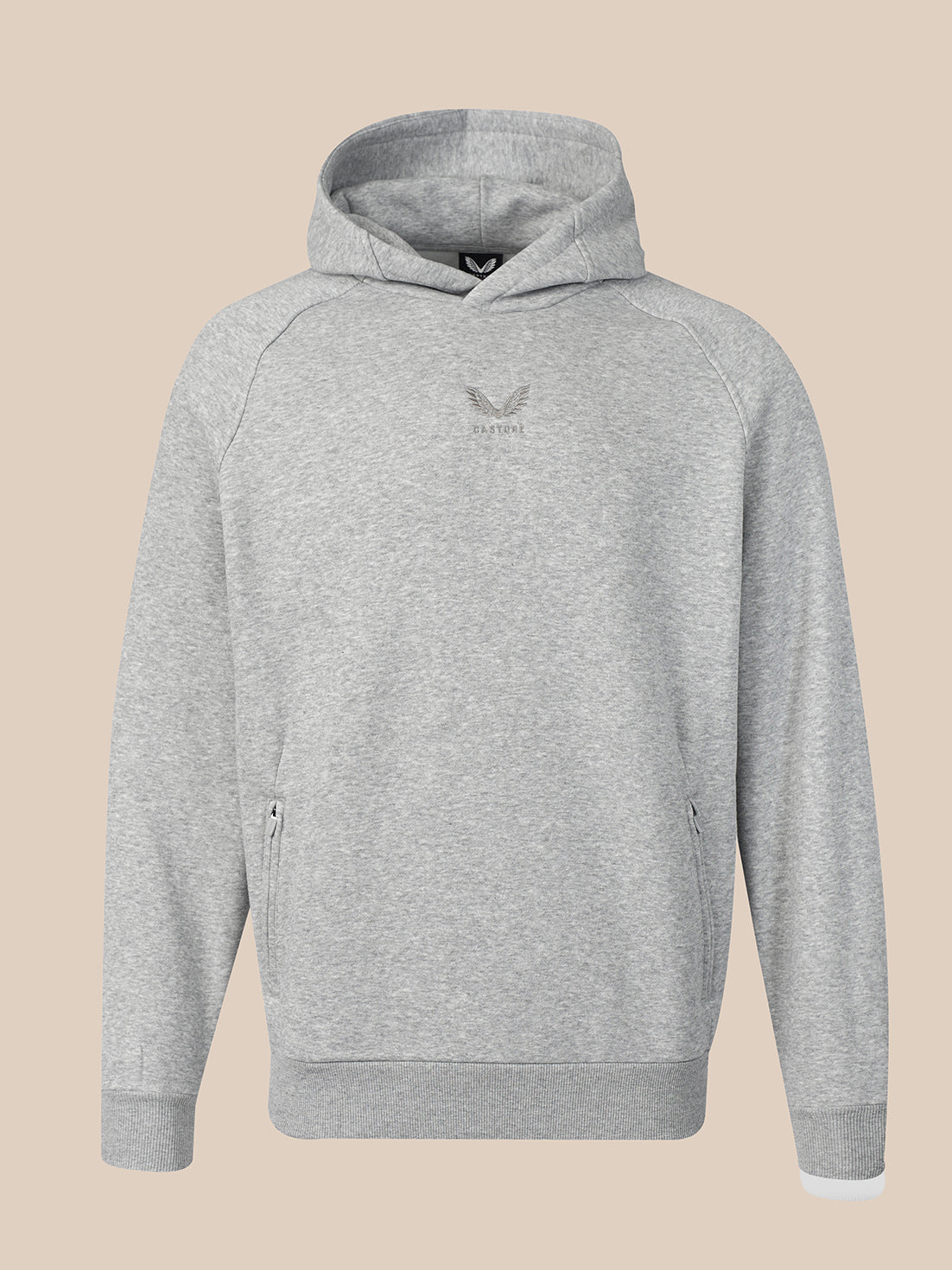 A light gray heather pullover hoodie with a small dark gray winged logo on the center chest, displayed against a solid beige background.