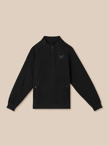 Black quarter-zip sweatshirt on a beige background