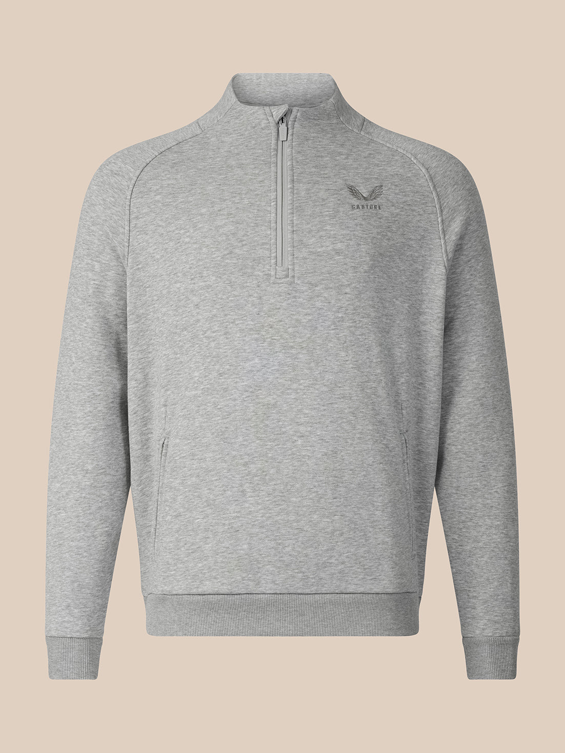 A light gray heathered quarter-zip sweatshirt with a small dark gray embroidered logo on the left chest, displayed on a solid beige background.