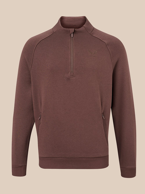 A men's brown quarter-zip pullover sweatshirt with a small tonal embroidered logo on the left chest, displayed on a neutral beige background.