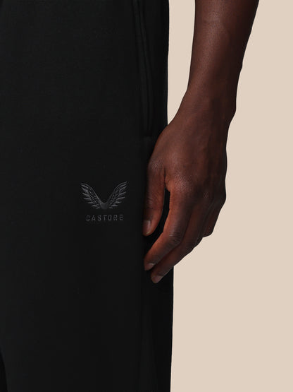 Black garment with a logo on a beige background