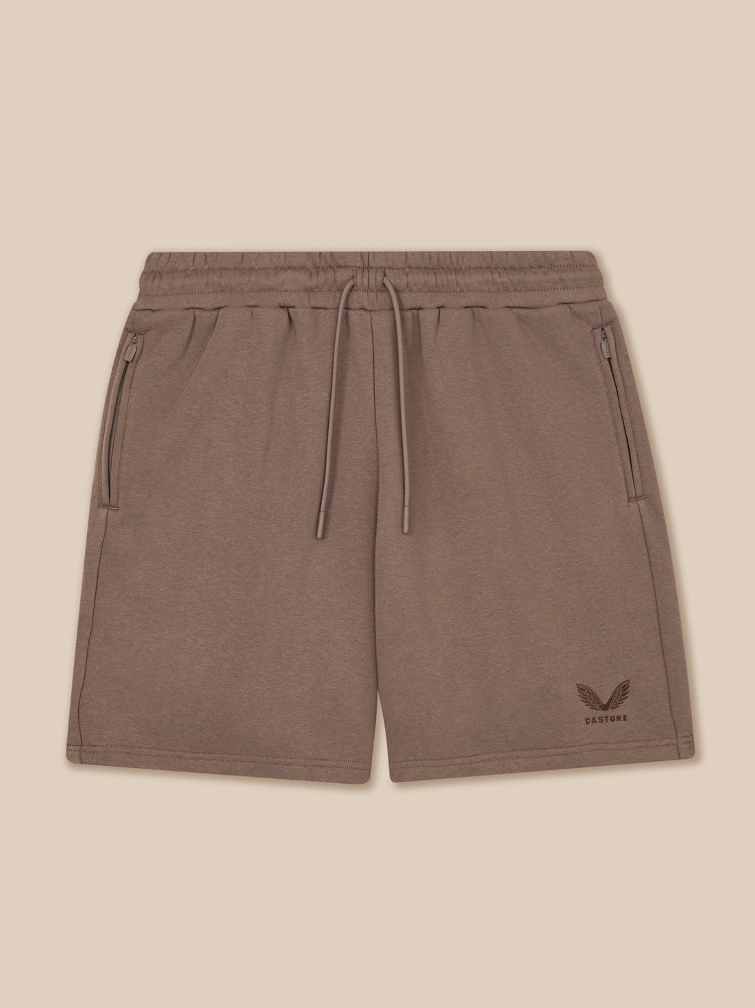 Brown shorts with a logo on a beige background