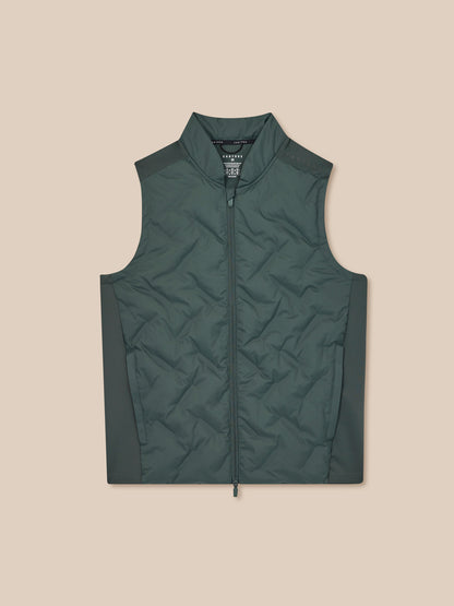 Green quilted vest on a beige background