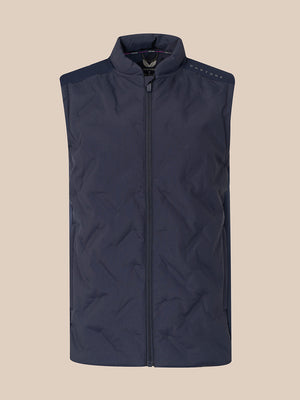 A sleeveless quilted puffer vest in dark navy blue, featuring a full-length front zipper, a stand-up collar, and subtle shoulder detailing, shown against a solid beige background.