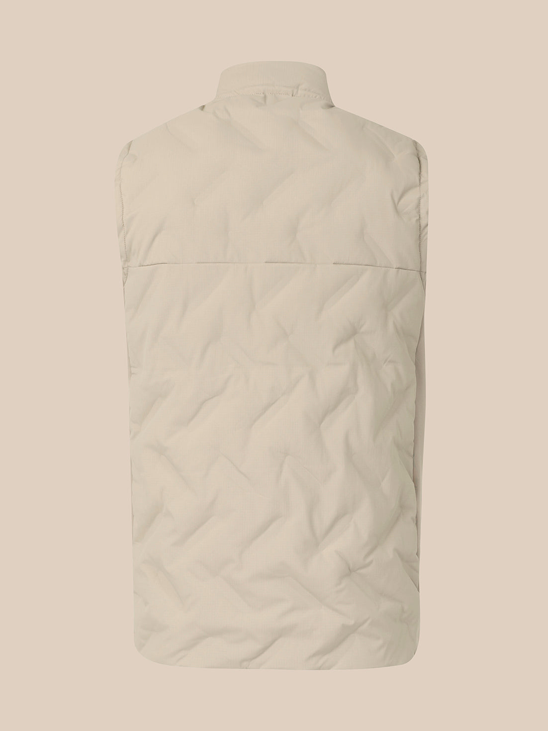The back view of a light beige quilted puffer vest on a matching solid beige background.