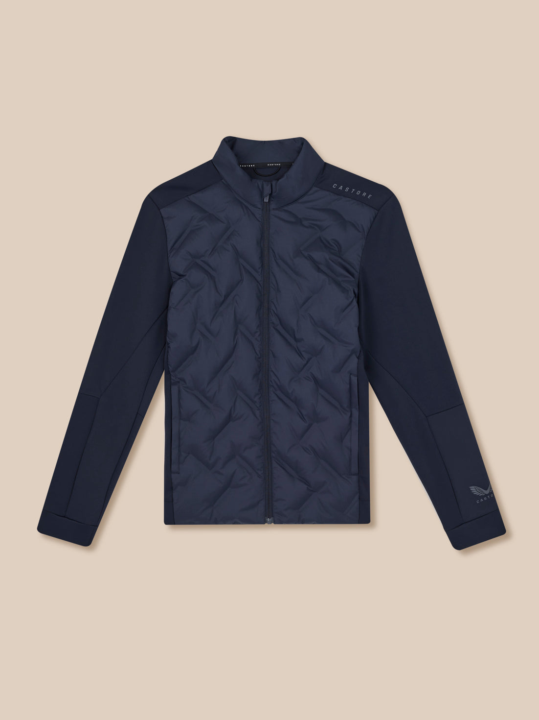 Navy quilted jacket on a beige background