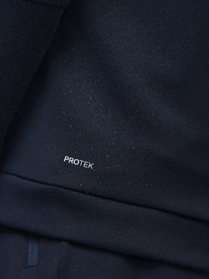 Close-up of dark blue fabric with 'PROTEK' branding.
