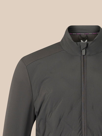 Close-up of a dark gray zip-up jacket with a stand collar, shown on a plain beige background.