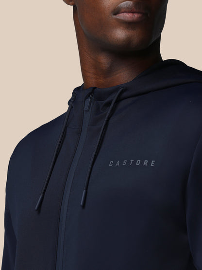 Navy hoodie with 'CASTORE' branding on a beige background