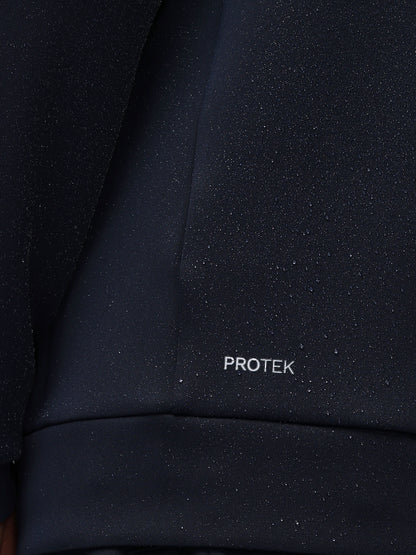 Close-up of a dark fabric surface with 'PROTEK' branding.