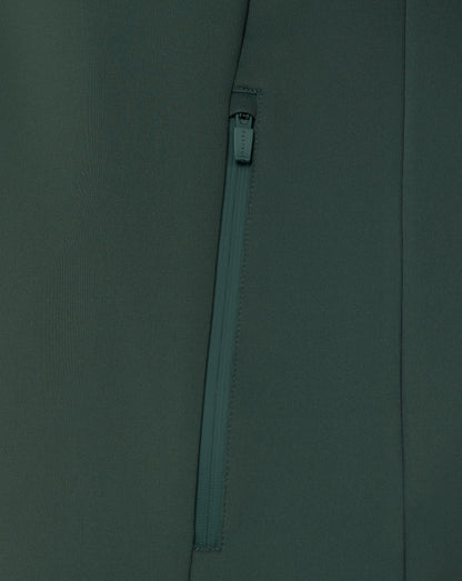 Close-up of a zipper on a dark green fabric background