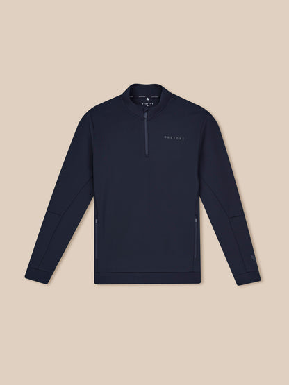Navy blue pullover with a quarter zip on a beige background