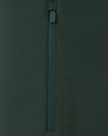 Dark green zipper on a dark green background with 'Castore' branding.