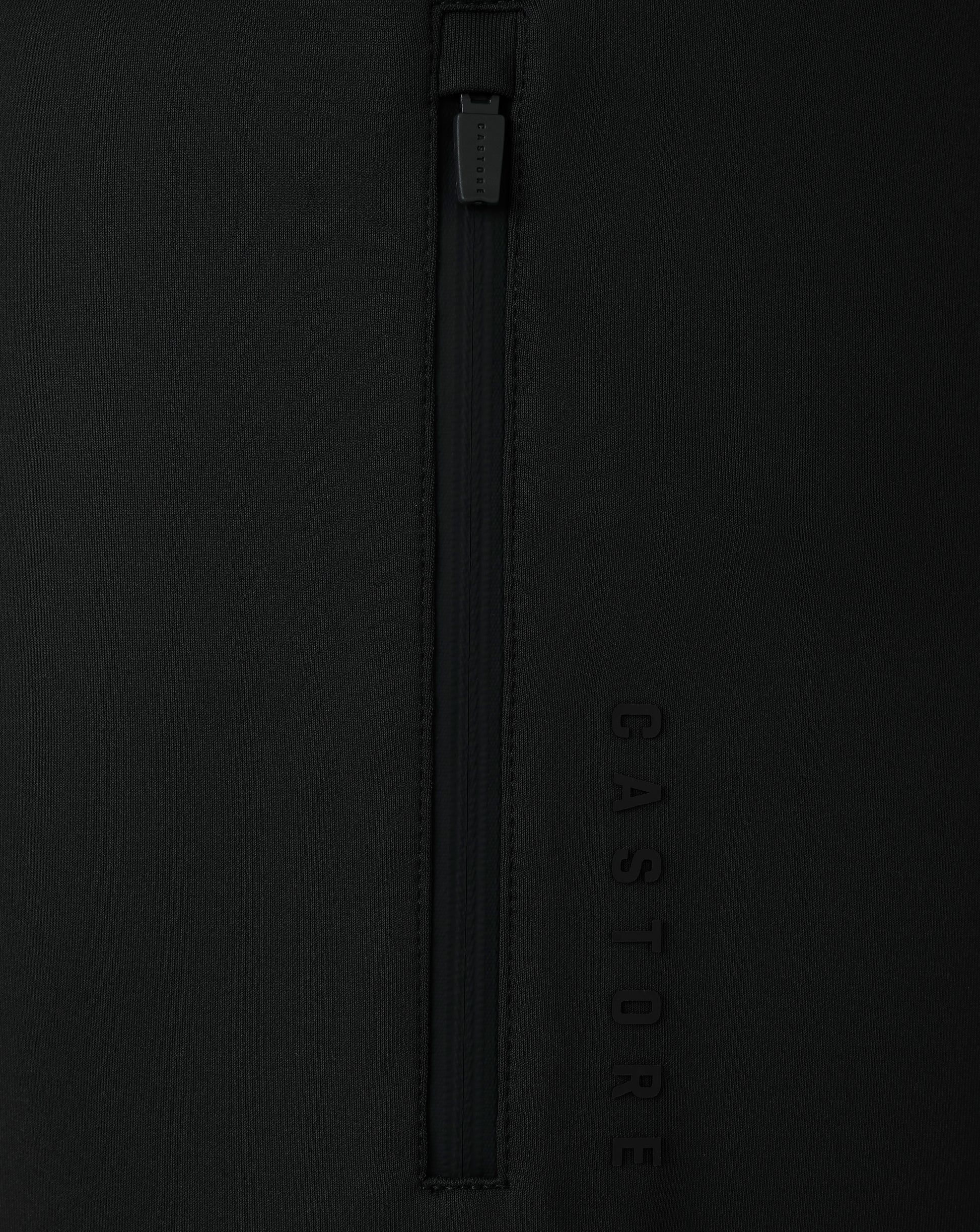 Black jacket with a zipper and 'Castore' branding on a black background