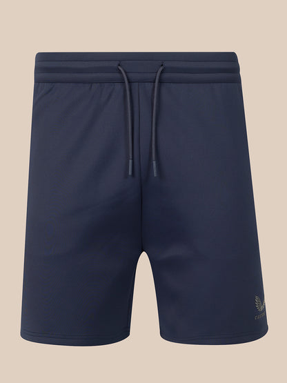 Navy blue athletic shorts with an elastic drawstring waistband, shown against a solid beige background.