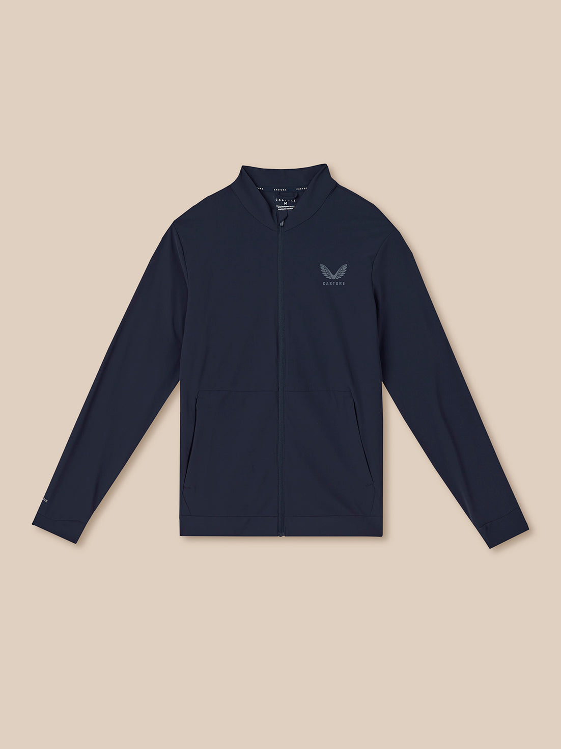 Navy blue jacket with a logo on a beige background