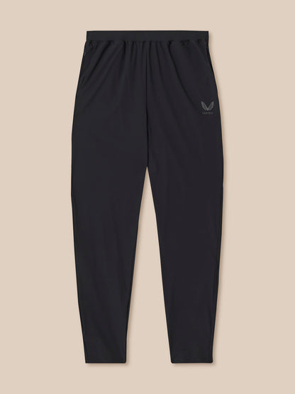 Black pants with a logo on a beige background