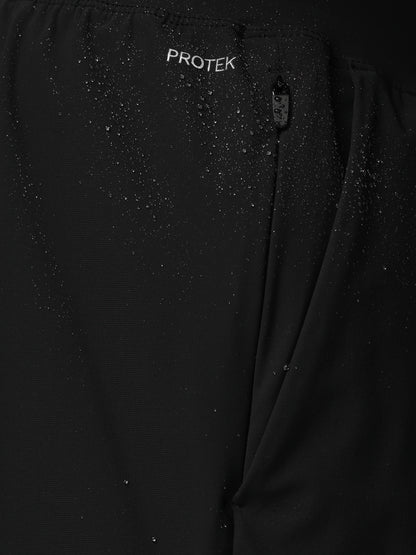 Black jacket with 'PROTEK' branding on a dark background