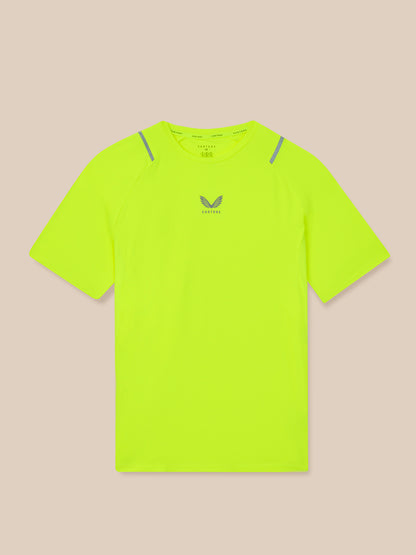 Bright yellow t-shirt with a brand logo on a beige background