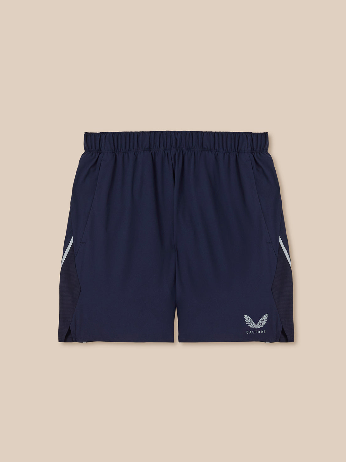 Navy athletic shorts with a logo on a beige background