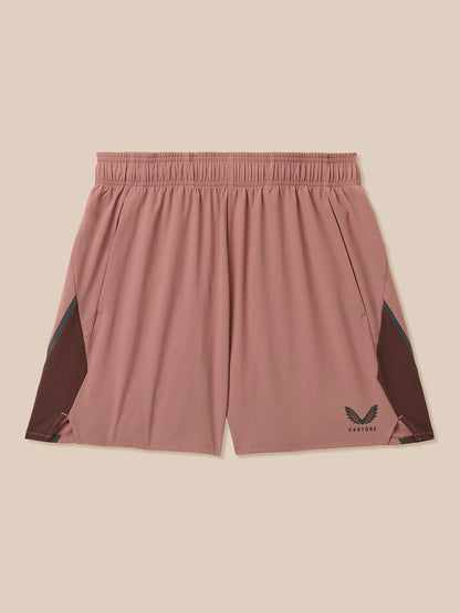 Beige men's 6 inch athletic shorts with inner brief, mesh side panels and Castore logo