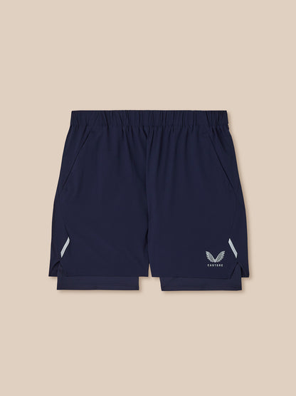 Navy blue shorts with a logo on a beige background