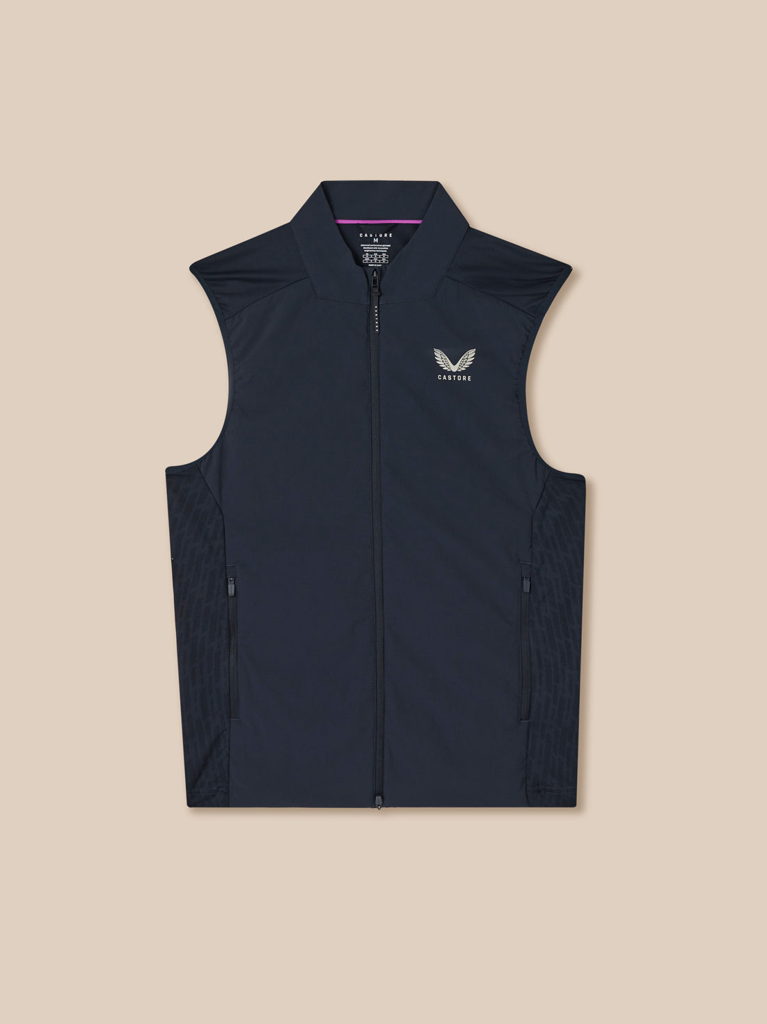 Black vest with a logo on a beige background