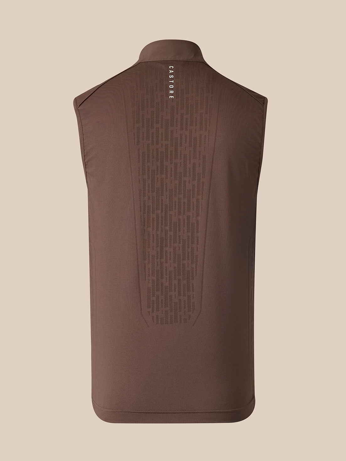 A sleeveless brown vest shown from the back, featuring a subtle vertical geometric pattern and the brand name 'CASTORE' printed in white near the collar, set against a solid beige background.