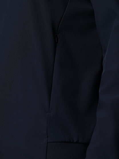 Close-up of a dark gray jacket with a zipper